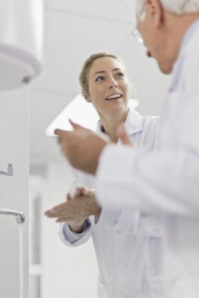 Scientists talking in pathology lab